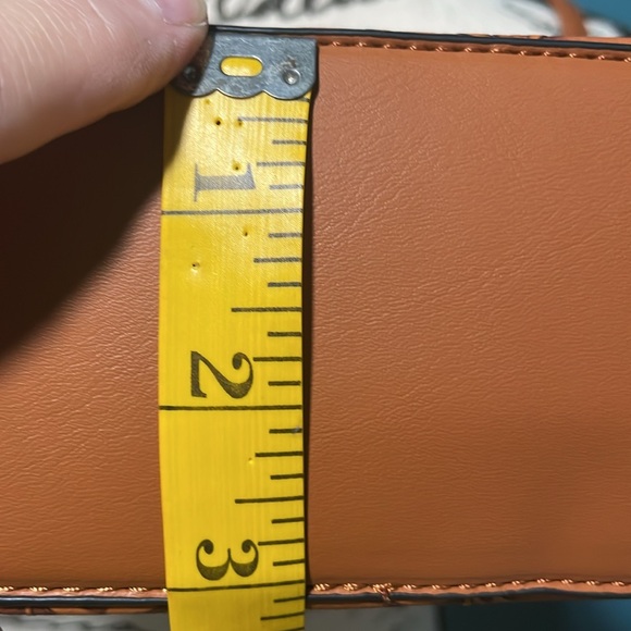 NWOT Small crossbody embossed leaf pattern, front zippered pocket, fringe pulls - Picture 10 of 10